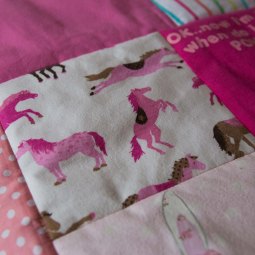 Keepsake quilts with lovely pastels with bright pink accents